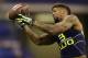 Louisiana State wide receiver Odell Beckham makes a catch during a drill at the NFL football scouting combine in Indianapolis, Sunday, Feb. 23, 2014. (AP Photo/Michael Conroy)