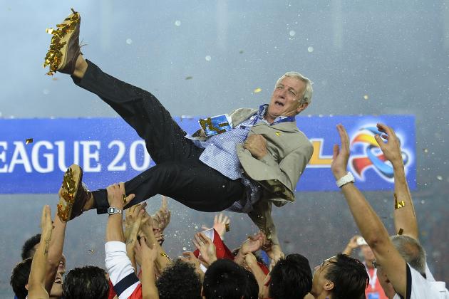 In this Saturday, Nov. 9, 2013 photo, China's Guangzhou Evergrande players throw their coach Marcello Lippi into the air after winning the final match against South Korea's FC Seoul in the 2013 Asian Champions League final at Tianhe stadium in Guangzhou in south China's Guangdong province. Lippi guided Chinese champion Guangzhou Evergrande to the continental title on Saturday night, becoming the first coach to win both the top European and Asian club titles. (AP Photo) CHINA OUT