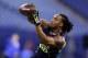 Auburn running back Tre Mason makes a catch as he runs a drill at the NFL football scouting combine in Indianapolis, Sunday, Feb. 23, 2014. (AP Photo/Michael Conroy)