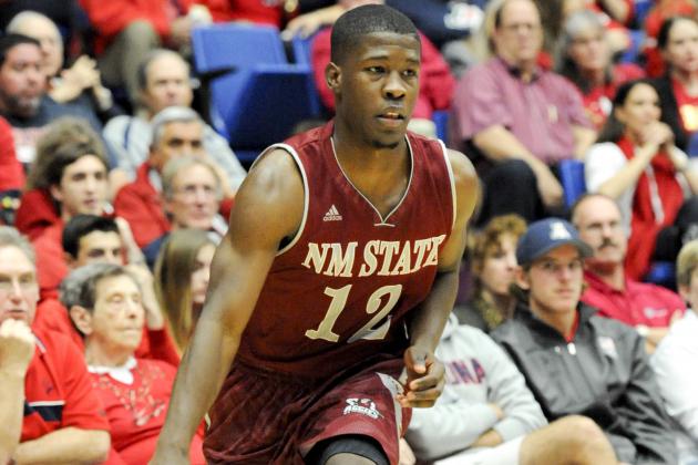 Dec 11, 2013; Tucson, AZ, USA; New Mexico State Aggies guard K.C. Ross-Miller (12) dribbles the ball during the first half against the Arizona Wildcats at McKale Center. Mandatory Credit: Casey Sapio-USA TODAY Sports