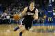 Sacramento Kings guard Jimmer Fredette (7) drives during an NBA basketball game against the Oklahoma City Thunder in Oklahoma City, Sunday, Jan. 19, 2014. Oklahoma City won 108-93.(AP Photo/Sue Ogrocki)
