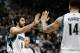 MINNEAPOLIS, MN - OCTOBER 30: Ricky Rubio #9 and Nikola Pekovic #14 of the Minnesota Timberwolves celebrate a play during the game against the Orlando Magic on October 30, 2013 at Target Center in Minneapolis, Minnesota. NOTE TO USER: User expressly acknowledges and agrees that, by downloading and or using this Photograph, user is consenting to the terms and conditions of the Getty Images License Agreement. (Photo by Hannah Foslien/Getty Images)