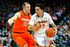 CHARLOTTESVILLE, VA - MARCH 01: London Perrantes #23 of the Virginia Cavaliers drives to the basket against the defense of Trevor Cooney #10 of the Syracuse Orange during the first half at John Paul Jones Arena on March 1, 2014 in Charlottesville, Virginia. (Photo by Rich Barnes/Getty Images)