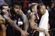 Fordham's Travion Leonard, left, and Chris Whitehead, watch play during the second half of an NCAA college basketball game against Massachusetts, Sunday, Jan. 26, 2014, in Amherst, Mass. Massachusetts won 90-52. (AP Photo/Jessica Hill)