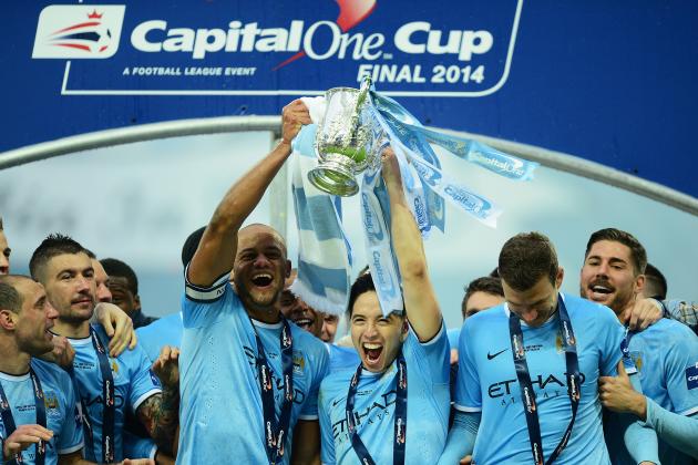 LONDON, ENGLAND - MARCH 02:  Vincent Kompany and Samir Nasri of Manchester City lift the trophy with team mates after the Capital One Cup Final between Manchester City and Sunderland at Wembley Stadium on March 2, 2014 in London, England.  (Photo by Jamie McDonald/Getty Images)