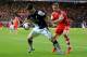SOUTHAMPTON, ENGLAND - MARCH 01: Luke Shaw of Southampton challenges Luis Suarez of Liverpool during the Barclays Premier League match between Southampton and Liverpool at St Mary's Stadium on March 1, 2014 in Southampton, England. (Photo by David Cannon/Getty Images)