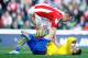 STOKE ON TRENT, ENGLAND - MARCH 01: Olivier Giroud of Arsenal is consoled by Charlie Adam of Stoke City during the Barclays Premier League match between Stoke City and Arsenal at Britannia Stadium on March 1, 2014 in Stoke on Trent, England. (Photo by Laurence Griffiths/Getty Images)