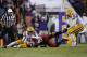 Nov 29, 2013; Baton Rouge, LA, USA; Arkansas Razorbacks quarterback Brandon Allen (10) fumbles the ball between LSU Tigers defensive end Jermauria Rasco (59) and cornerback Dwayne Thomas (13) in the fourth quarter at Tiger Stadium. LSU defeated Arkansas 31-27. Mandatory Credit: Crystal LoGiudice-USA TODAY Sports