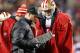 San Francisco 49ers head coach Jim Harbaugh talks with quarterback Colin Kaepernick during the second half of an NFL football game against the Washington Redskins in Landover, Md., Monday, Nov. 25, 2013. (AP Photo/Alex Brandon)