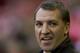 Liverpool's manager Brendan Rodgers smiles as he takes to the touchline before his team's English Premier League soccer match against Swansea City at Anfield Stadium, Liverpool, England, Sunday Feb. 23, 2014. (AP Photo/Jon Super)