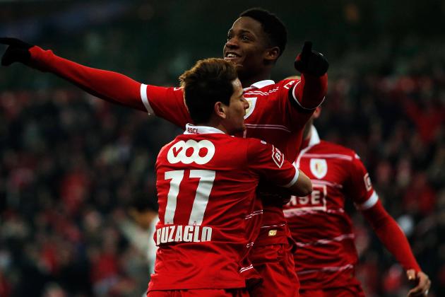 LIEGE, BELGIUM - JANUARY 25:  Michy Batshuayi of Standard is congratulated by team mate Maor Buzaglo after he scores a goal during the Jupiler League match between Standard de Liege and KV Kortrijk at Stade Maurice Dufrasne the on January 25, 2013 in Liege, Belgium.  (Photo by Dean Mouhtaropoulos/Getty Images)