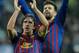 MADRID, SPAIN - DECEMBER 10: Carles Puyol (L) and Gerard Pique celebrate after Barcelona beat Real Madrid 3-1 during the La Liga match between Real Madrid and Barcelona at Estadio Santiago Bernabeu on December 10, 2011 in Madrid, Spain. (Photo by Denis Doyle/Getty Images)