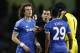 Chelsea's David Luiz, left, is shown a yellow card by referee Phil Dowd, second left during their English FA Cup fifth round soccer match against Manchester City at the Etihad Stadium, Manchester, England, Saturday, Feb. 15, 2014. (AP Photo/Jon Super)
