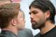 Jan 21, 2014; Los Angeles, CA, USA; Canelo Alvarez and Alfredo Angulo (right) face off during a press conference held at the Los Angeles Central Public Library to announce the 12-round super welterweight bout on March 8, 2014 at the MGM Grand, Las Vegas. Mandatory Credit: Jayne Kamin-Oncea-USA TODAY Sports