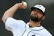 Detroit Tigers relief pitcher Joba Chamberlain warms up before the seventh inning of an exhibition baseball game against the Pittsburgh Pirates in Lakeland, Fla., Tuesday, March 4, 2014. The Pirates won 5-2. (AP Photo/Gene J. Puskar)