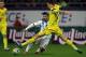 Argentina's Sergio Aguero, left, challenges for the ball with Romania's Florin Gardos, left, during an international friendly soccer game on the National Arena stadium in Bucharest, Romania, Wednesday, March 5, 2014. (AP Photo/Vadim Ghirda)