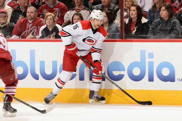 GLENDALE, AZ - DECEMBER 14:  Tuomo Ruutu #15 of the Carolina Hurricanes looks to pass the puck against the Phoenix Coyotes at Jobing.com Arena on December 14, 2013 in Glendale, Arizona.  (Photo by Norm Hall/NHLI via Getty Images)