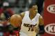 Miami Heat point guard Mario Chalmers (15) drives down court in the second period in an NBA basketball game against the Atlanta Hawks in Atlanta, Monday, Jan. 20, 2014. Hawks won the game 121-114 (AP Photo/Todd Kirkland)