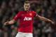 Manchester United's Nemanja Vidic takes the ball downfield during his team's English Premier League soccer match against Swansea City at Old Trafford Stadium, Manchester, England, Saturday Jan. 11, 2014. (AP Photo/Jon Super)