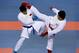 Japan's Hideyoshi Kagawa, right, fights against China's Peng Hui to win their men's +84kg karate gold medal match at the sixth East Asian Games in Tianjin, China, Monday, Oct. 14, 2013. (AP Photo/Alexander F. Yuan)