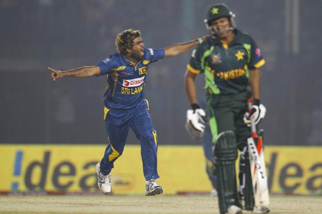 Sri Lanka’s Lasith Malinga, left, celebrates taking the wicket of Pakistan’s Bilawal Bhatti during the opening match of the Asia Cup one-day international cricket tournament between them in Fatullah, near Dhaka, Bangladesh, Tuesday, Feb. 25, 2014. Sri Lanka won by 12 runs. (AP Photo/A.M. Ahad)