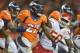 Denver Broncos running back Knowshon Moreno (27) runs the ball against Kansas City Chiefs outside linebacker Justin Houston (50) in the third quarter of an NFL football game, Sunday, Nov. 17, 2013, in Denver. (AP Photo/Jack Dempsey)