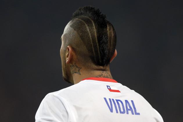 Chile's Arturo Vidal watches his team mates during the international friendly soccer match between Germany and Chile in Stuttgart, Germany, Wednesday, March 5, 2014. (AP Photo/Matthias Schrader)
