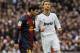 Real Madrid's Cristiano Ronaldo from Portugal, right, and FC Barcelona's Lionel Messi from Argentina, left, gesture during a Spanish La Liga soccer match at the Santiago Bernabeu stadium in Madrid, Spain, Saturday, March 2, 2013. (AP Photo/Andres Kudacki)