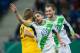 Hoffenheim's Ricardo Rodriguez, left, and Bas Dost celebrate their side's second goal during a German soccer cup quarterfinal match between TSG 1899 Hoffenheim and VFL Wolfsburg in Sinsheim, Germany, Wednesday, Feb. 12, 2014. (AP Photo/dpa,Uwe Anspach)