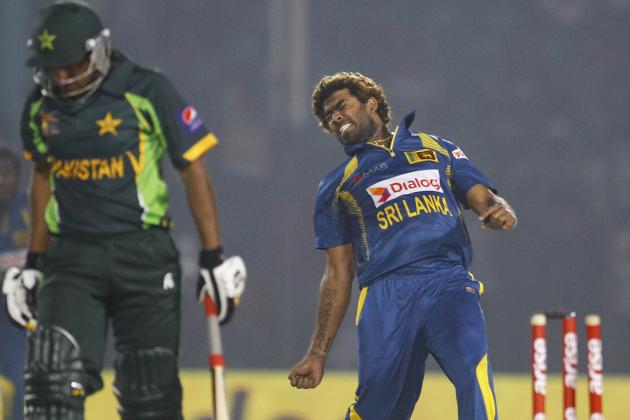 Sri Lanka’s Lasith Malinga, right, celebrates taking the wicket of Pakistan’s Bilawal Bhatti during the opening match of the Asia Cup one-day international cricket tournament between them in Fatullah, near Dhaka, Bangladesh, Tuesday, Feb. 25, 2014. (AP Photo/A.M. Ahad)
