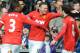 Manchester United's Wayne Rooney celebrates with Juan mata, right, and Patrice Evra after scoring against West Brom during the English Premier League soccer match between West Bromwich Albion and Manchester United at The Hawthorns Stadium in West Bromwich, England, Saturday, March 8, 2014. (AP Photo/Rui Vieira)