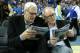 LOS ANGELES, CA - JANUARY 09: NBA coaching legend Phil Jackson (L) and actor John Lithgow consult their programs before the game between the Arizona Wildcats and the UCLA Bruins at Pauley Pavilion on January 9, 2014 in Los Angeles, California. (Photo by Stephen Dunn/Getty Images)