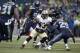New Orleans Saints running back Darren Sproles (43) runs against Seattle Seahawks free safety Earl Thomas (29) during an NFC divisional playoff NFL football game in Seattle, Saturday, Jan. 11, 2014. (AP Photo/Elaine Thompson)
