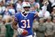 Nov 17, 2013; Orchard Park, NY, USA; Buffalo Bills free safety Jairus Byrd (31) celebrates his first half interception against the New York Jets at Ralph Wilson Stadium. Mandatory Credit: Timothy T. Ludwig-USA TODAY Sports