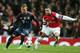 Arsenal's Alex Oxlade-Chamberlain, right, and Bayern's Mario Goetze challenge for the ball during a Champions League, round of 16, first leg soccer match between Arsenal and Bayern Munich at the Emirates stadium in London, Wednesday, Feb. 19, 2014 .(AP Photo/Alastair Grant)