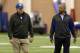 New York Giants head coach Tom Coughlin, left, and general manager Jerry Reese walk off the field after a minicamp in East Rutherford, N.J., Thursday, June 13, 2013. (AP Photo/Seth Wenig)
