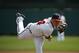 Atlanta Braves starting pitcher Kris Medlen (54) warms up from the mound before the first inning in a spring exhibition baseball game against the Washington Nationals, Tuesday, March 4, 2014, in Kissimmee, Fla. (AP Photo/Alex Brandon)