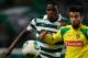 Sporting's William Carvalho, left, fights for the ball with Pacos de Ferreira's Sergio Oliveira during their Portuguese league soccer match Sunday, Dec. 1, 2013, at Sporting's Alvalade stadium in Lisbon. (AP Photo/Armando Franca)
