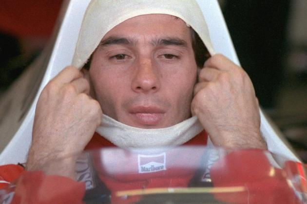 FILE -- Brazilian driver Ayrton Senna, adjusts his fireproof covering while sitting in his McLaren Honda before a practice session at the Australian Grand Prix in this Nov. 4, 1989 file photo. Nearly three years after Senna was killed in a crash at the San Marino Grand Prix in Italy, six Formula One officials face trial on manslaughter charges Thursday in a case that could threaten the future of the sport. (AP Photo)