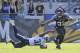 Jacksonville Jaguars running back Maurice Jones-Drew (32) makes a move to get around Tennessee Titans strong safety Bernard Pollard (31) during the first half of an NFL football game in Jacksonville, Fla., Sunday, Dec. 22, 2013.(AP Photo/Stephen Morton)