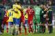 Arsenal's Per Mertesacker, front left, hugs Bayern's Dante after the Champions League round of 16 second leg soccer match between FC Bayern Munich and FC Arsenal in Munich, Germany, Wednesday, March 12, 2014. (AP Photo/Matthias Schrader)