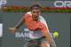 Rafael Nadal, of Spain, returns a shot to Alexandr Dolgopolov, of Ukraine, during their match at the BNP Paribas Open tennis tournament, Monday, March 10, 2014, in Indian Wells, Calif. Dolgopolov won 6-3, 3-6, 7-6 (5). (AP Photo/Mark J. Terrill)