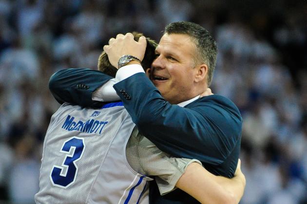 OMAHA, NE - MARCH 8: Doug McDermott #3 of the Creighton Bluejays receives a hug from head coach and father Greg McDermott of the Creighton Bluejays after scoring his 3000th career point during their game against the Providence Friars at CenturyLink Center on March 8, 2014 in Omaha, Nebraska. (Photo by Eric Francis/Getty Images)