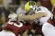 Oregon defensive tackle Taylor Hart (66) tackles Stanford running back Tyler Gaffney (25) during an NCAA college football game in Stanford, Calif., Thursday, Nov. 7, 2013. (AP Photo/Jeff Chiu)