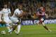 Barcelona's Lionel Messi, right shoots on goal during a Champions League, round of 16, second leg, soccer match between FC Barcelona and Manchester City at the Camp Nou Stadium in Barcelona, Spain, Wednesday March 12, 2014. (AP Photo/Emilio Morenatti)