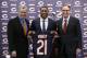 Chicago Bears general manager Phil Emery, left, poses with safety Ryan Mundy and head coach Marc Trestman after Mundy was introduced as the newest member of the team during a news conference Wednesday, March 12, 2014, in Lake Forest, Ill. (AP Photo/Charles Rex Arbogast)