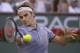 Roger Federer, of Switzerland, returns a shot against Tommy Haas, of Germany, during a match at the BNP Paribas Open tennis tournament, Wednesday, March 12, 2014, in Indian Wells, Calif. (AP Photo/Mark J. Terrill)