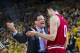 Indiana head coach Tom Crean, left, gestures and speaks with forward Will Sheehey (0) in the second half of an NCAA college basketball game against Indiana at Crisler Center in Ann Arbor, Mich., Saturday, March 8, 2014. Michigan won 84-80. (AP Photo/Tony Ding)