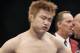 Takanori Gomi reacts after his loss to Clay Guida shortley after their UFC lightweight mixed martial arts match Saturday, Jan. 1, 2011 at The MGM Grand Garden Arena in Las Vegas. Guida won by submission. (AP Photo/Eric Jamison)