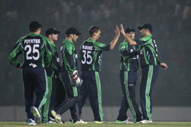 Ireland’s Andy McBrine, center, celebrates with teammates the dismissal of Nepal’s Sharad Vesawkar during a warm-up cricket match ahead of the Twenty20 World Cup Cricket in Fatullah, near Dhaka, Bangladesh, Wednesday, March 12, 2014. (AP Photo/A.M. Ahad)